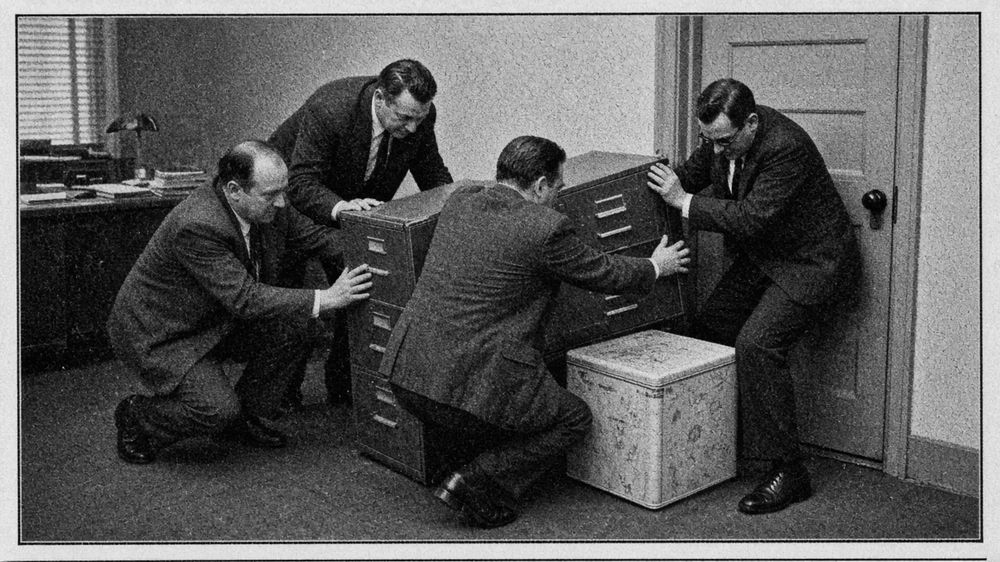 Council staff practise forming a defensive circle around a laminated map of Kinross-shire.